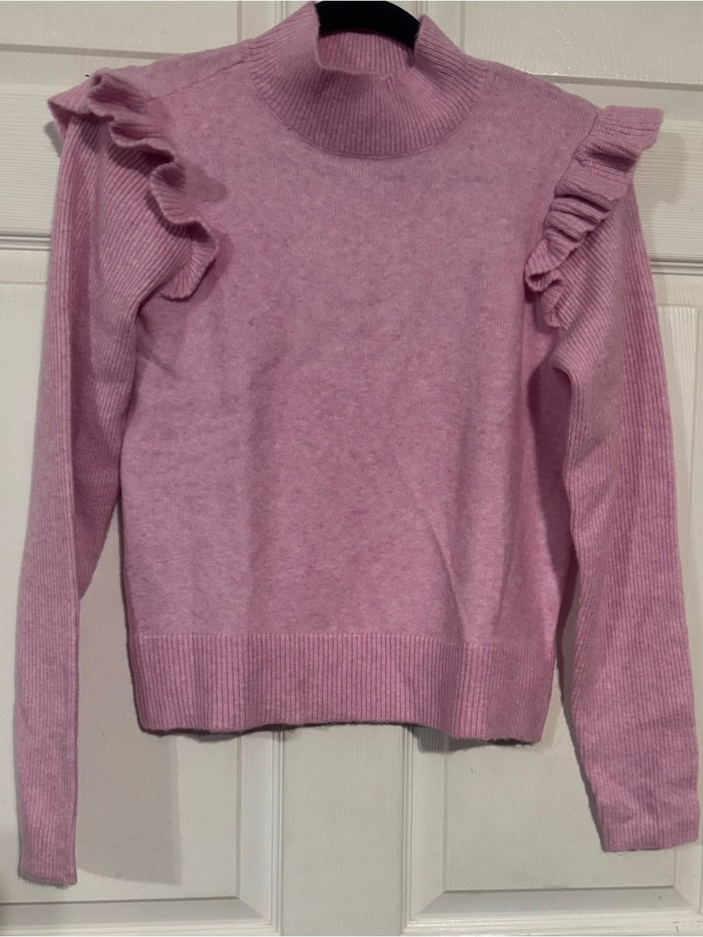 Pink ruffle shoulder mock neck knit sweater